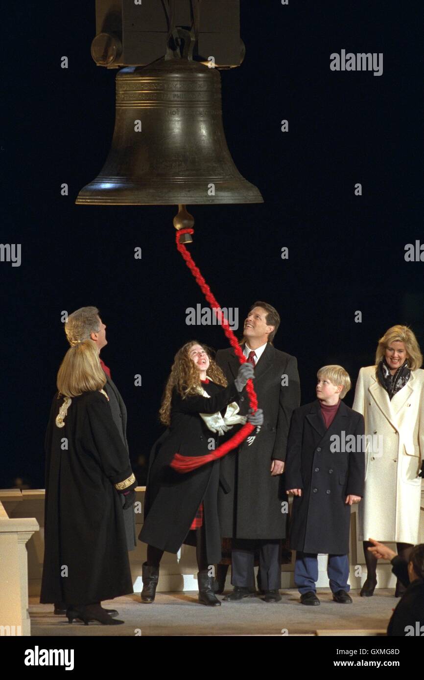 U.S. President-elect Bill Clintons daughter Chelsea Clinton and Vice President-elect Al Gore ring a Liberty Bell replica during a ceremony marking the start of the 1993 Clinton/Gore inauguration events January 17, 1993 in Arlington, Virginia. Stock Photo