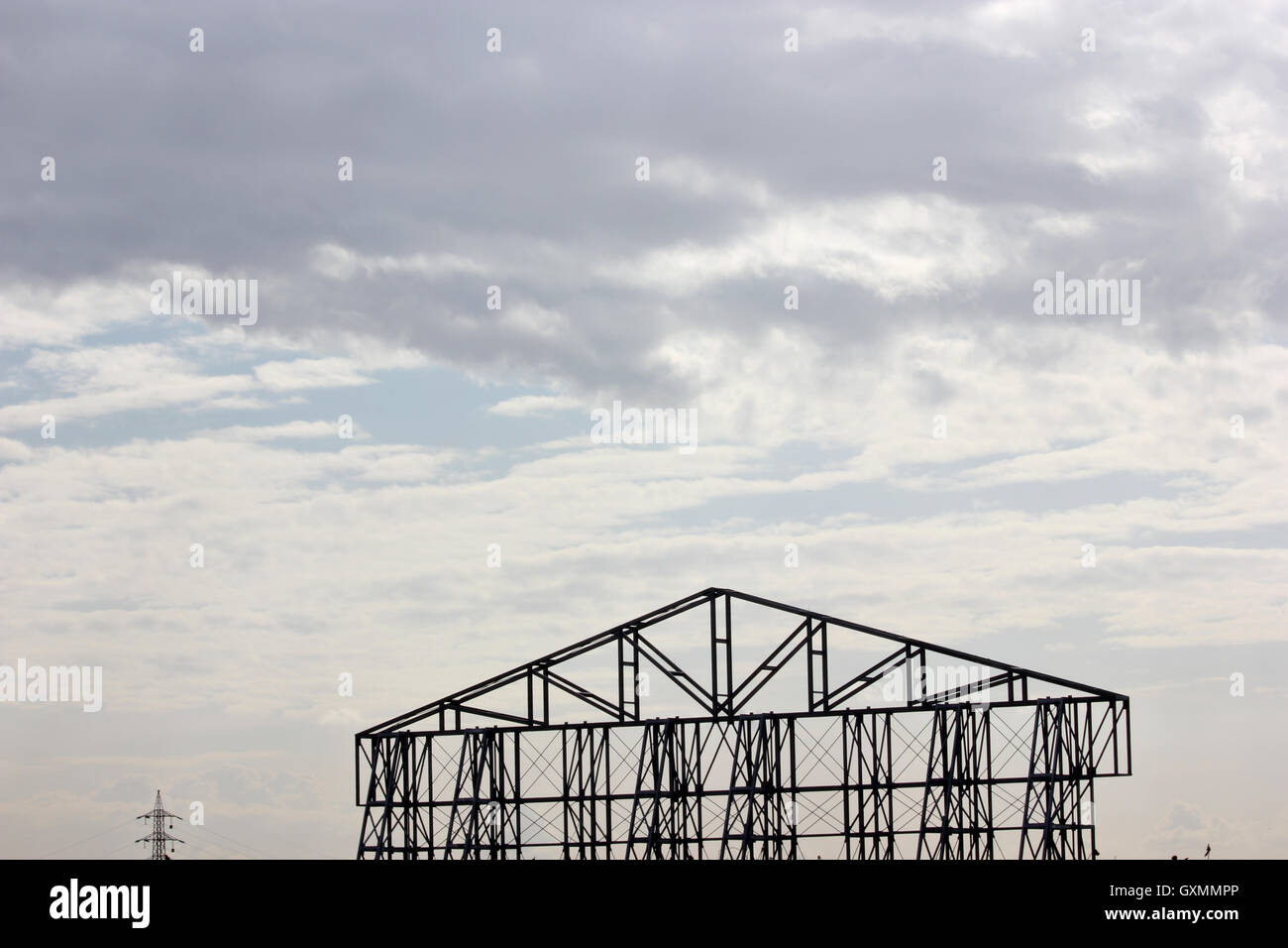 metal structure against a cloudy sky Stock Photo