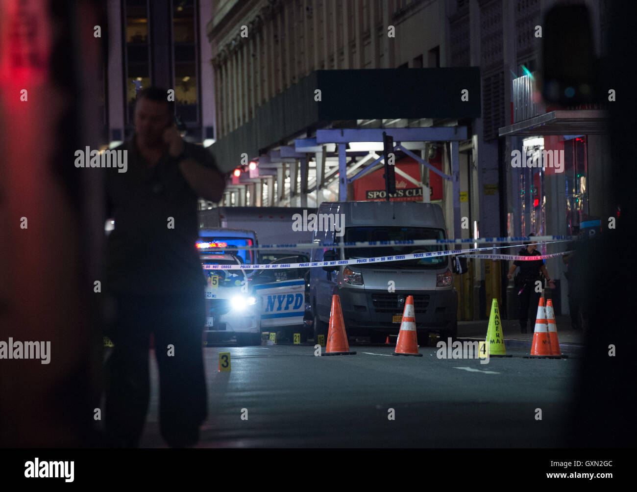 New York, NY, USA. 15th Sep, 2016. NYPD police look over a silver van of interest as police respond to a shooting police involved shooting on West 32nd Street between Sixth and Seventh Avenue, Thursday, September 15, 2016. Credit:  Bryan Smith/ZUMA Wire/Alamy Live News Stock Photo