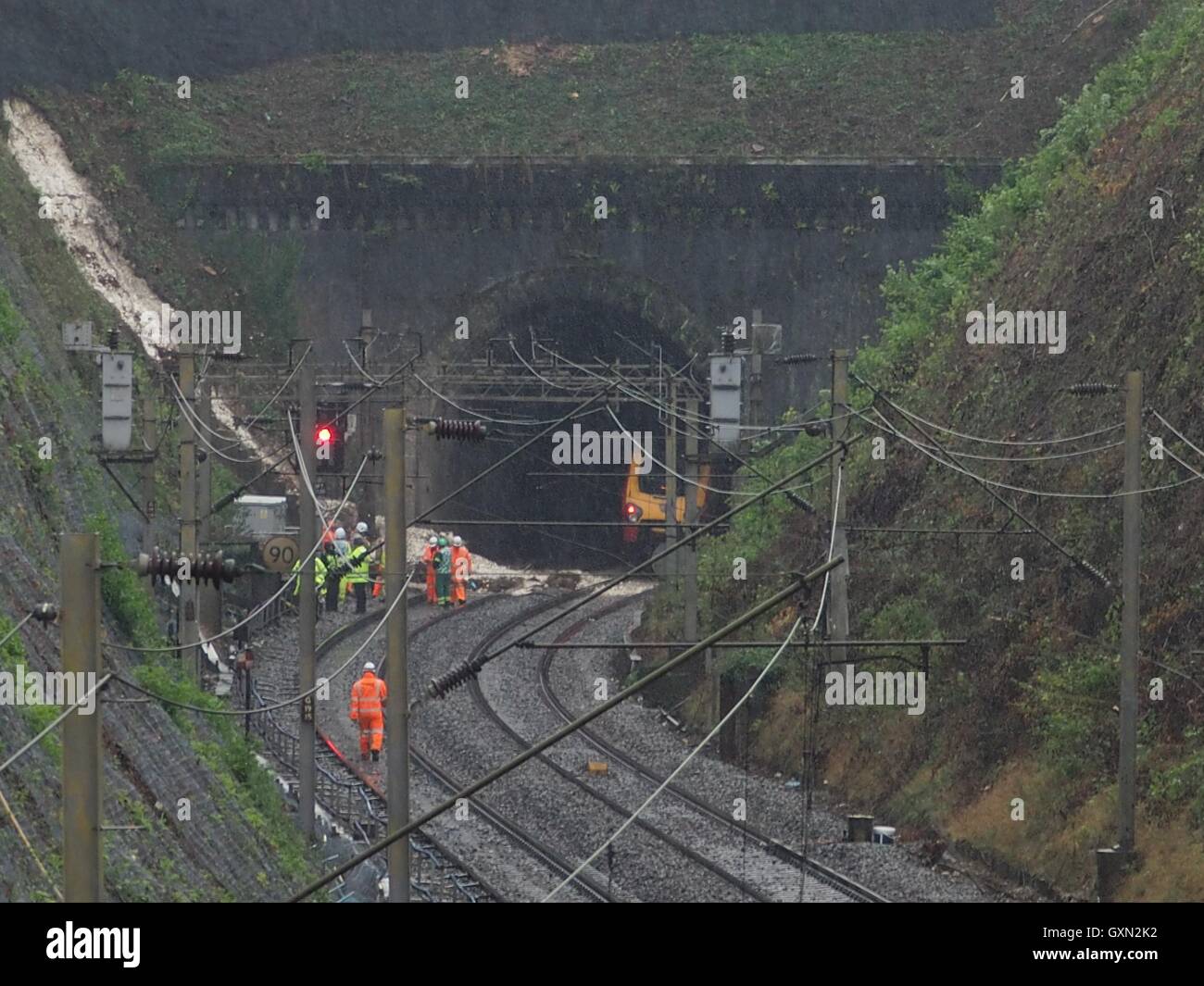 Hunton bridge near Watford, UK. 16th September, 2016. Hunton Bridge derailment, Near Watford. Network Rail, rescue workers on the track by the landslide caused by wet weather. Train stuck in railway tunnel. Pouring with rain. Credit:  Elizabeth Debenham/Alamy Live News Stock Photo