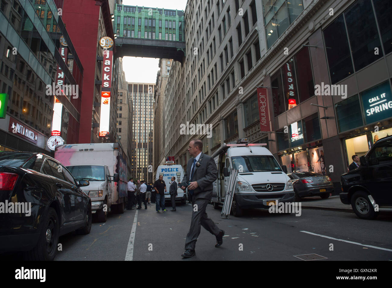 New York, NY, USA. 15th Sep, 2016. A Detective walks through the scene ...