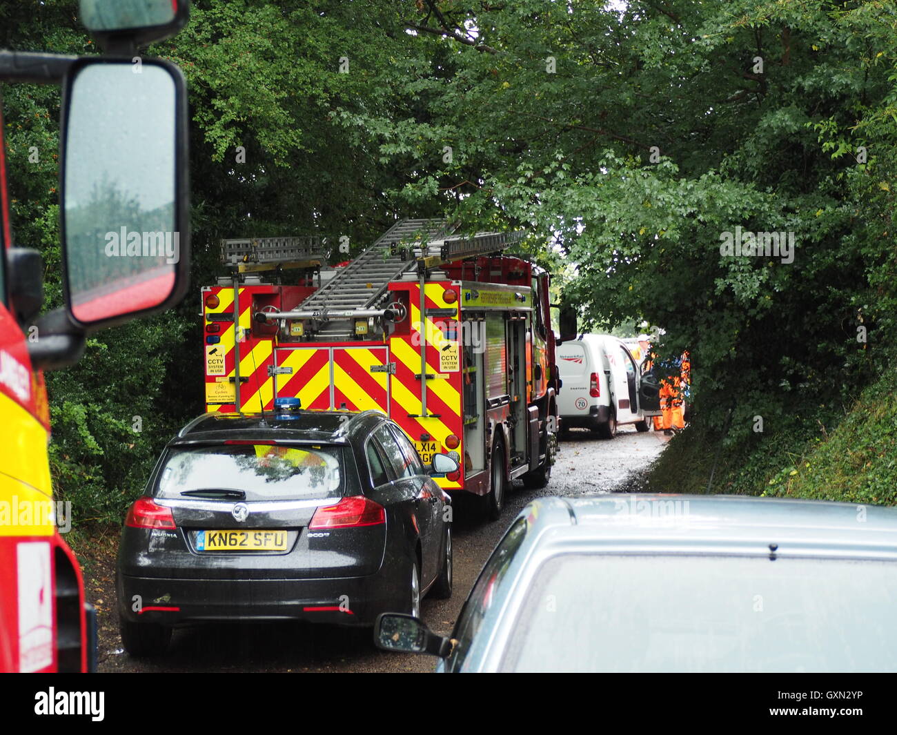 Fire engines parked in narrow lane attending for the rescue of London bound train's derailment at Hunton Bridge tunnel. Taken in Gypsy Lane, Hunton Bridge near Watford. Stock Photo