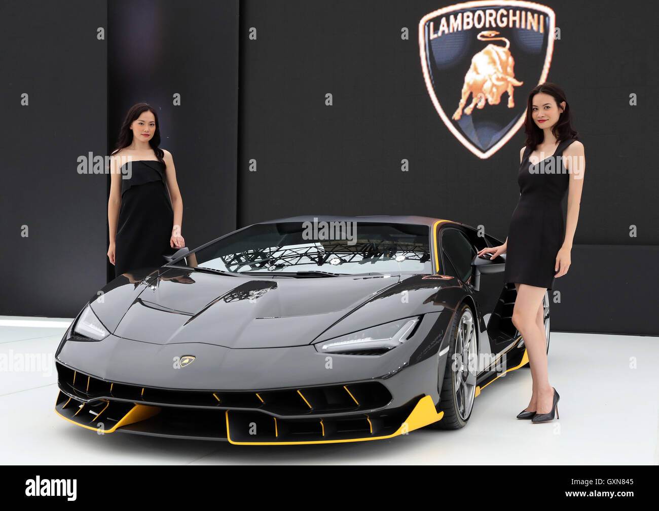 Tokyo, Japan. 16th September, 2016. Models display Italian sports car maker Automobili Lamborghini's flagship vehicle 'Centenario', 100th anniversary model of Lamborghini's founder Ferruccio Lamborghini in Tokyo on Friday, September 16, 2016. Lanborghini and Japan's chemical maker Mitsubishi Rayon announced their agreement to conduct joint development of carbon fiber reinforced plastic (CFRP) for vehicles. Credit:  Yoshio Tsunoda/AFLO/Alamy Live News Stock Photo