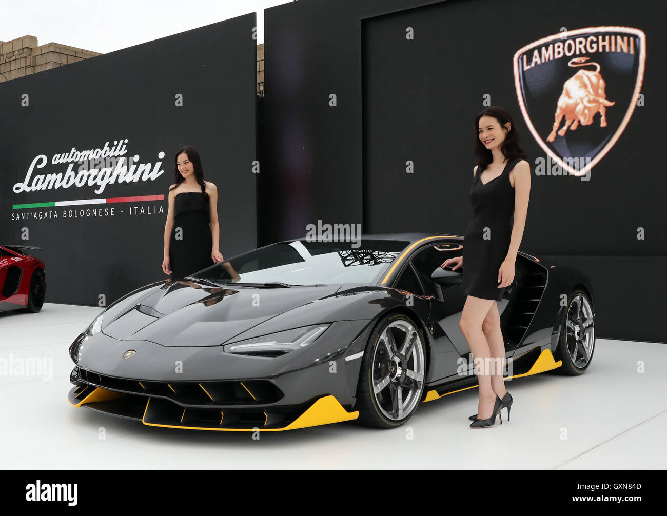 Tokyo, Japan. 16th September, 2016. Models display Italian sports car maker Automobili Lamborghini's flagship vehicle 'Centenario', 100th anniversary model of Lamborghini's founder Ferruccio Lamborghini in Tokyo on Friday, September 16, 2016. Lanborghini and Japan's chemical maker Mitsubishi Rayon announced their agreement to conduct joint development of carbon fiber reinforced plastic (CFRP) for vehicles. Credit:  Yoshio Tsunoda/AFLO/Alamy Live News Stock Photo