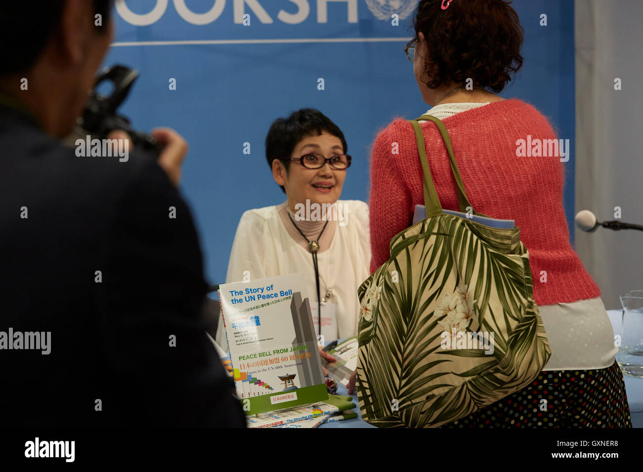 Author Seiko Takase, signs books and greeted guest at the UN Book Store on the International Day of Peace. Seiko Takase shares with us her father Chiyoji Nakagawa project known as the “Peace Bell” on the 35th Anniversary of the International Day of Peace. Stock Photo