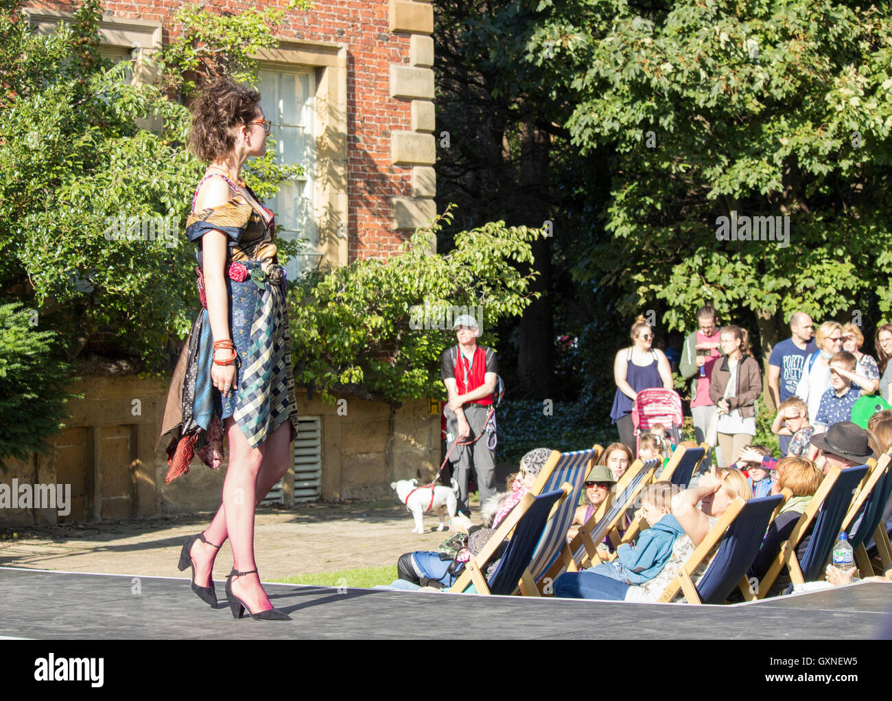 Kirkleatham, Redcar, England, UK. 17th September, 2016. Weather: Afternoon sunshine at Thrift festival. Winner of the 2015 Observer Arts & Culture award, The Festival of Thrift shows you how reusing, recycling and up cycling can be fun, save you money and benefit the environment. This year's festival features leading and emerging artists from across the globe, demonstrations, stalls, debates, workshops. The free festival, co-founded by famous designers, Wayne & Geradine Hemingway is expected to attract over 40,000 visitors. PICTURED: Dress made from old ties at Oxglam fashion show. All designs Stock Photo