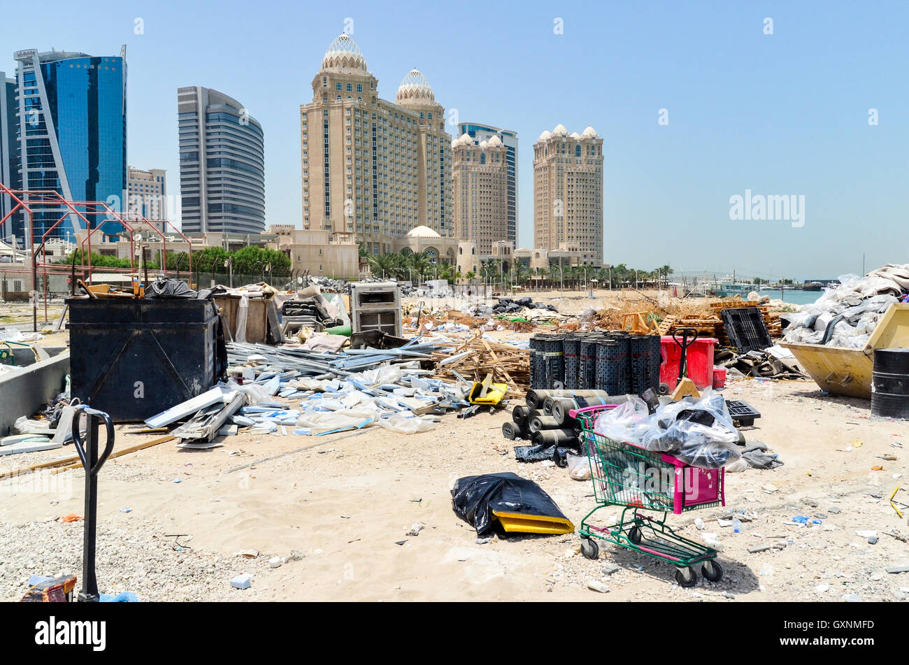 Trash on the beach in the West Bay financial district, Doha, Qatar Stock Photo