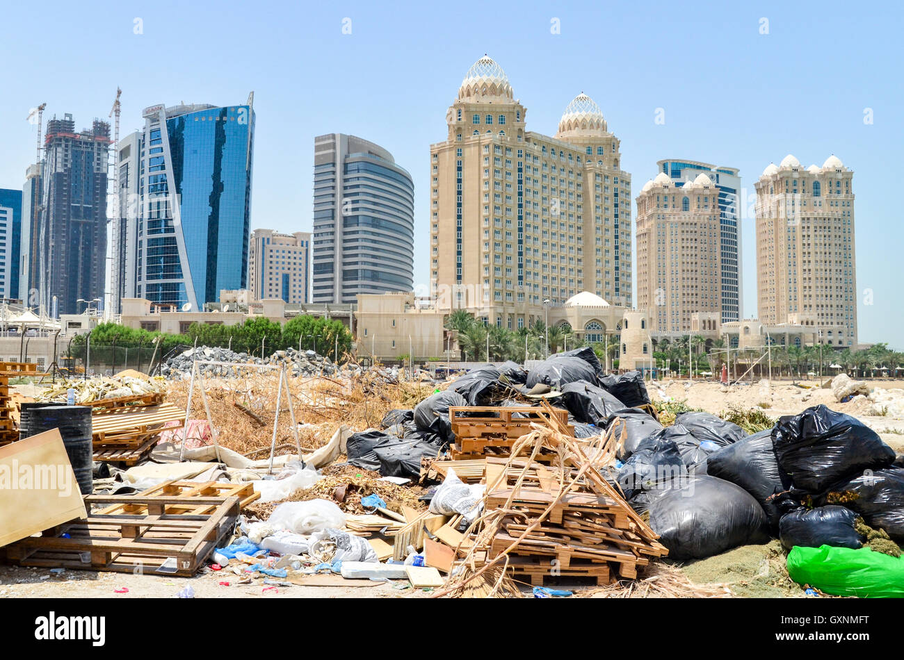 Trash on the beach in the West Bay financial district, Doha, Qatar Stock Photo