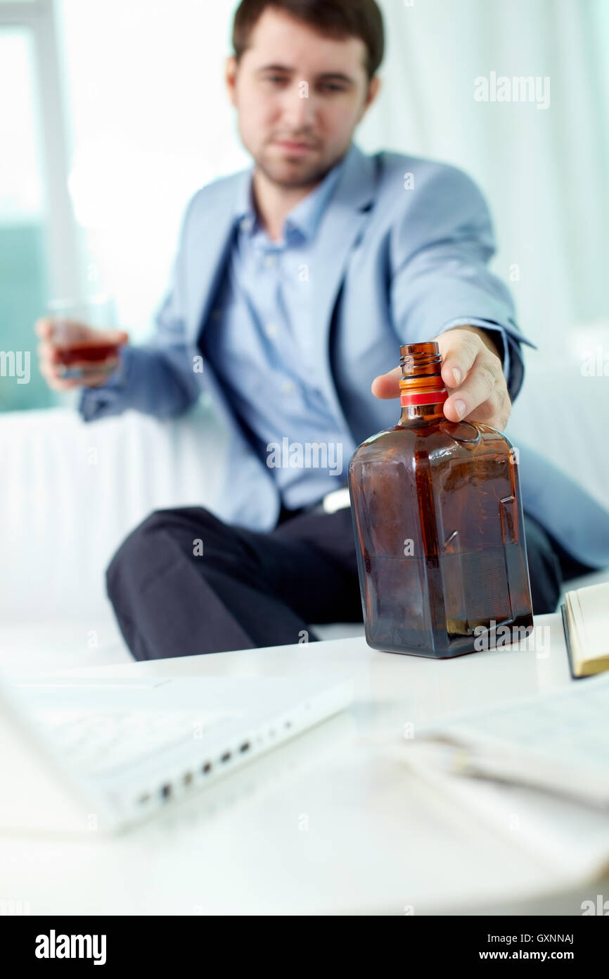 Businessman drinking alcohol Stock Photo