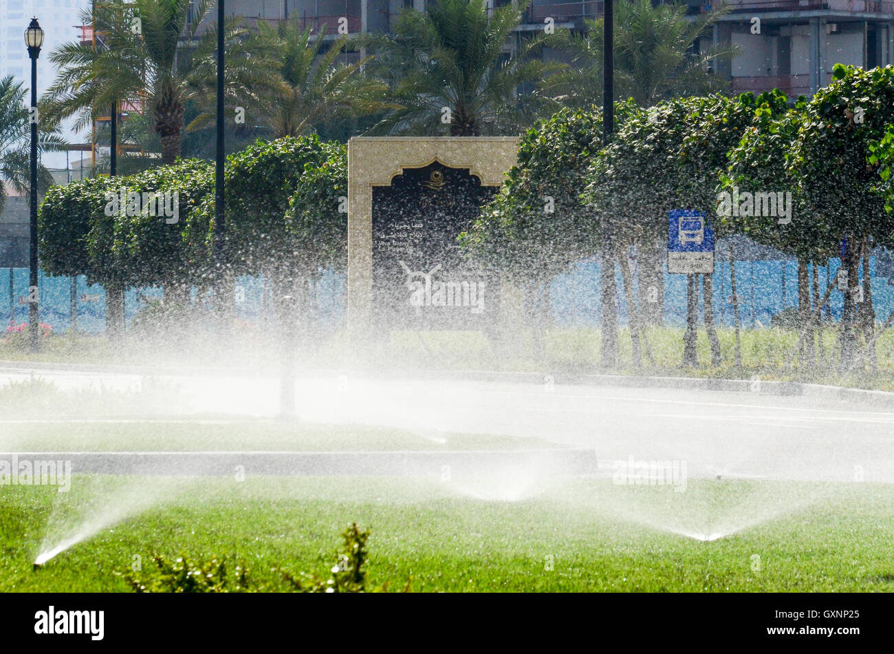 Watering the grass on the artificial island The Pearl-Qatar Stock Photo