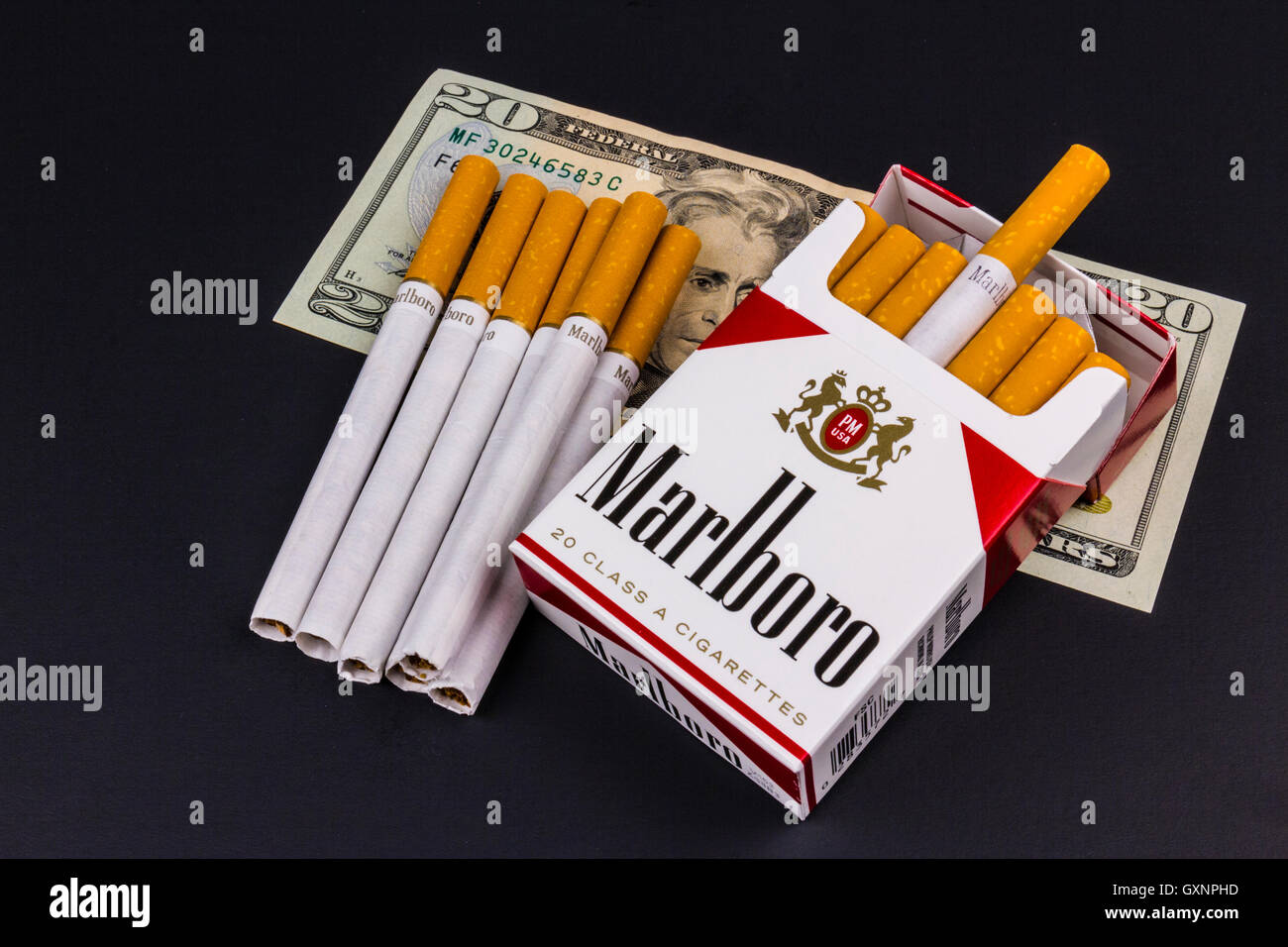 Indianapolis Circa August 2016 Marlboro Cigarettes and Twenty Dollar