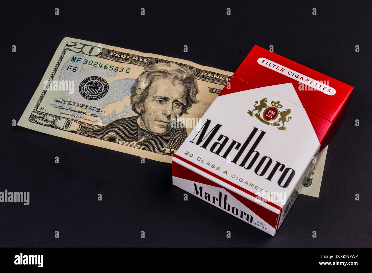 Indianapolis Circa August 2016 Marlboro Cigarettes and Twenty Dollar