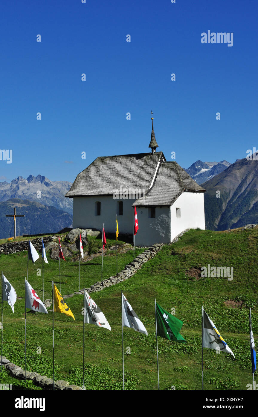 Bettmeralp church and flags in the Swiss Alps, Valais, Switzerland ...