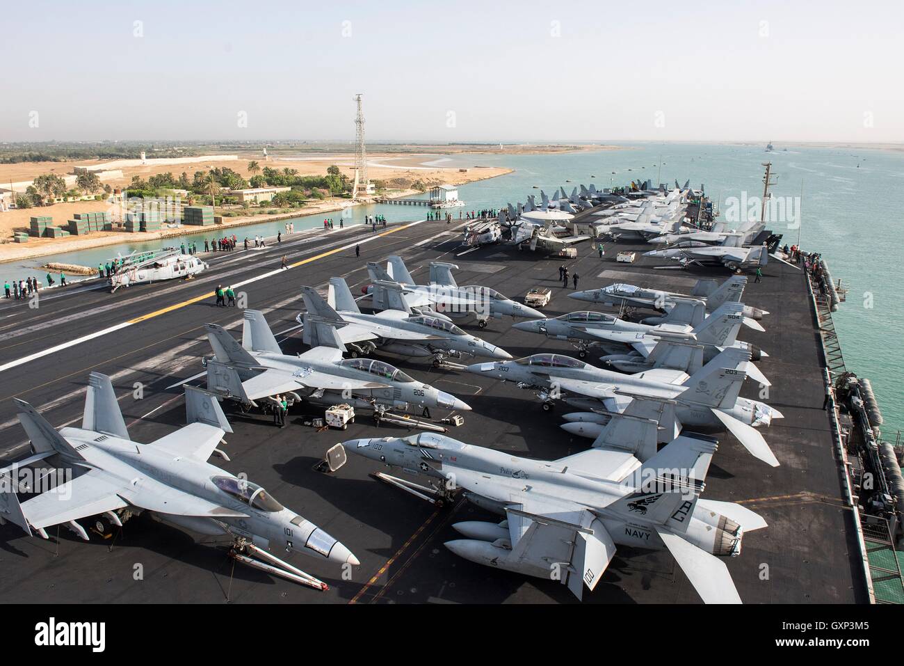 USN Nimitz-class aircraft carrier USS Harry S. Truman transits the Suez Canal June 2, 2016 in Egypt. The Harry S. Truman Carrier Strike Group is being deployed in support of Operation Inherent Resolve. Stock Photo