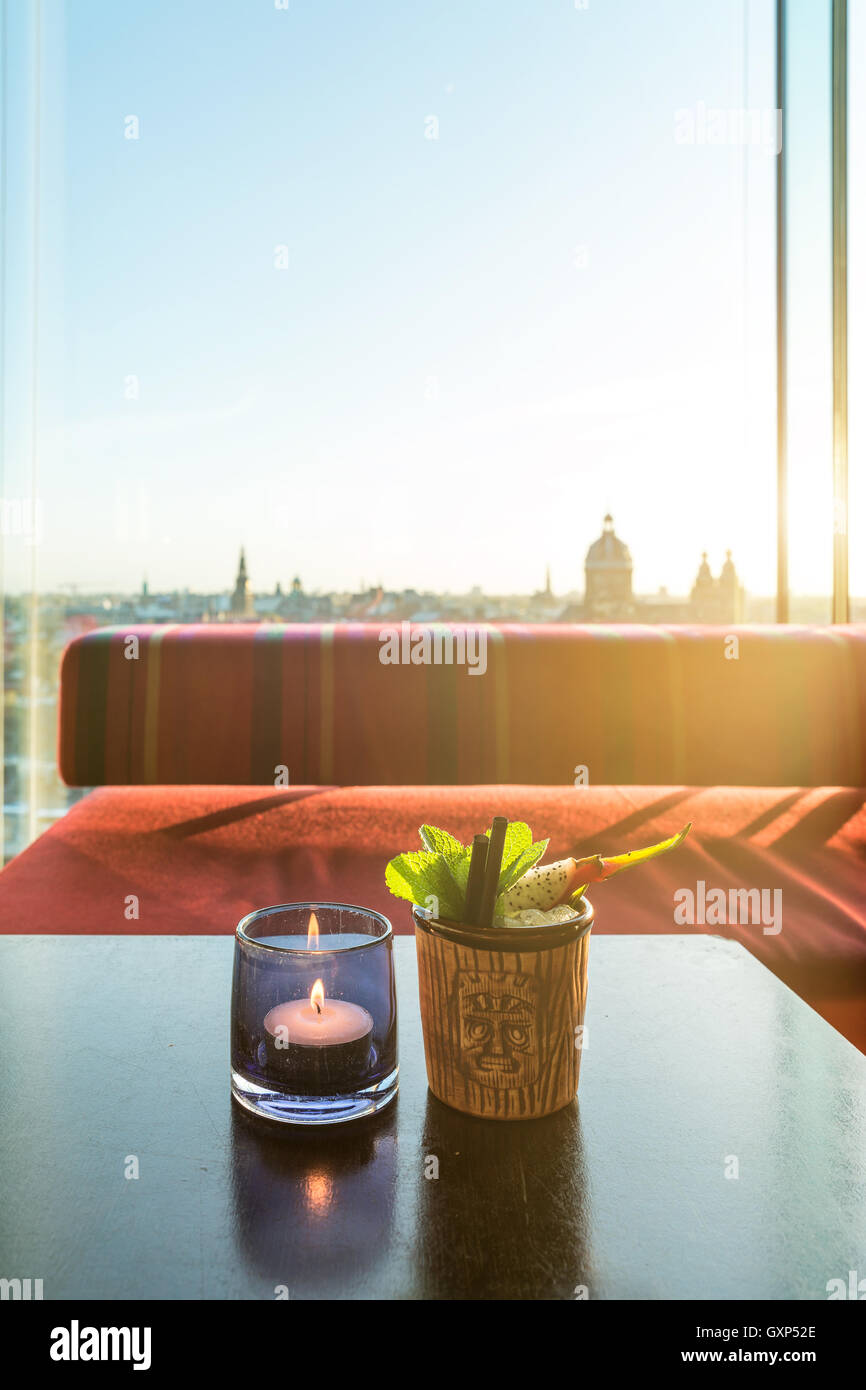 Tropical fruit dragon fruit cocktail on table in rooftop bar in