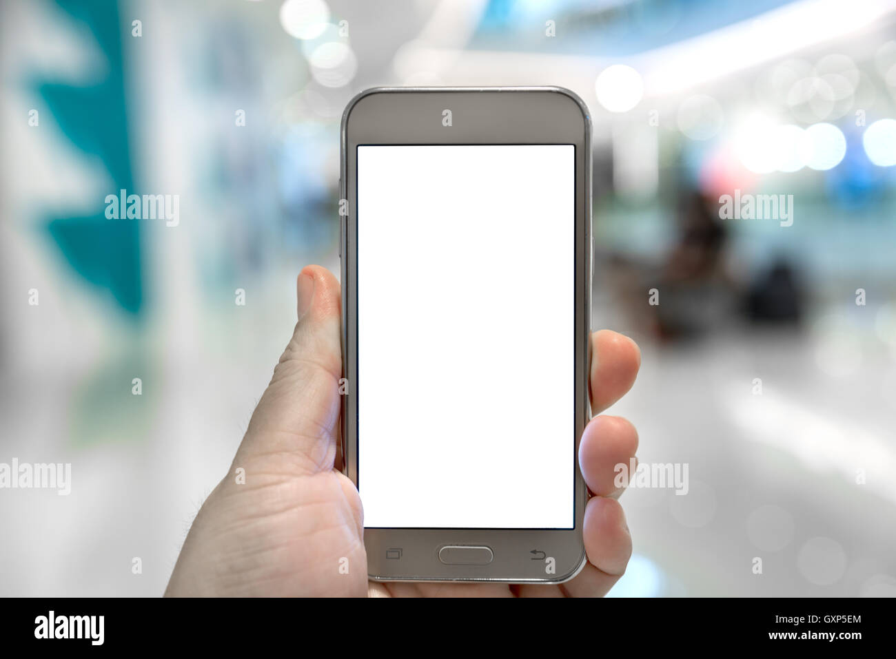 Hand touch screen on the smart phone in shopping mall. White background on smart phone use for advertise. Stock Photo