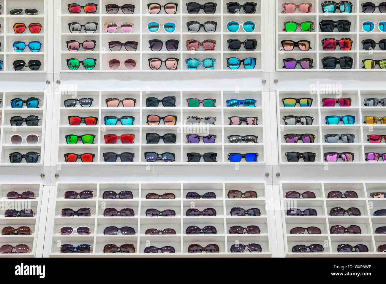 Sunglasses on sale display shelf in sunglasses shop at the city market Stock Photo