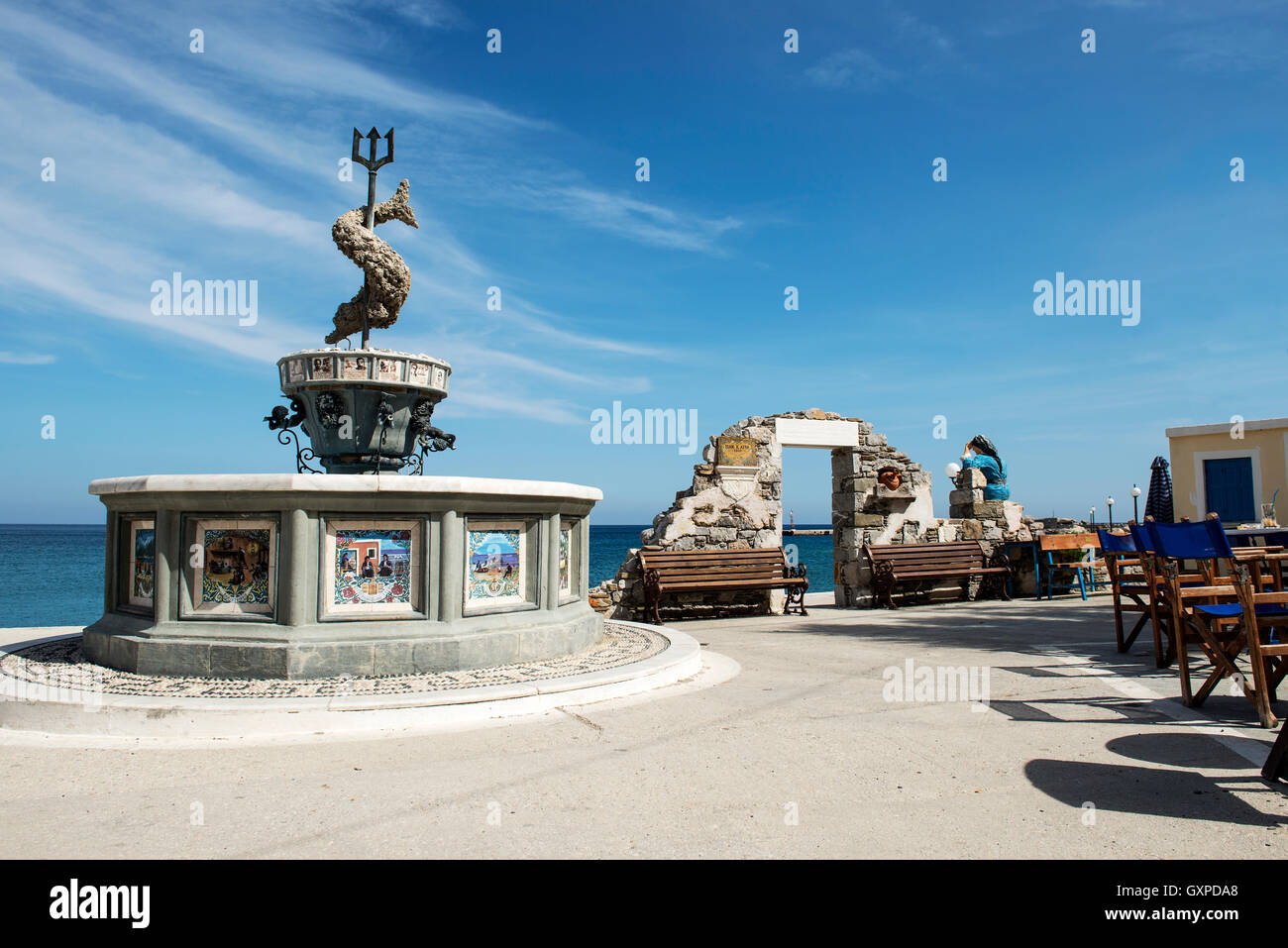 Fountain of Neptune in Diafani, a tranquil holiday seaside village on the island of Karpathos, Dodecanese islands, Greece Stock Photo