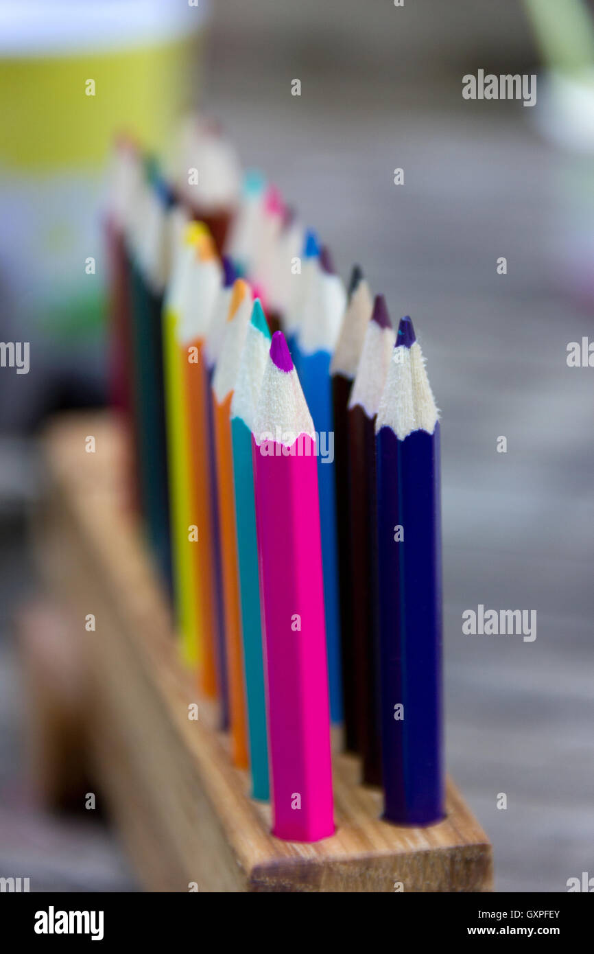 Colored pencils in a holder Stock Photo Alamy