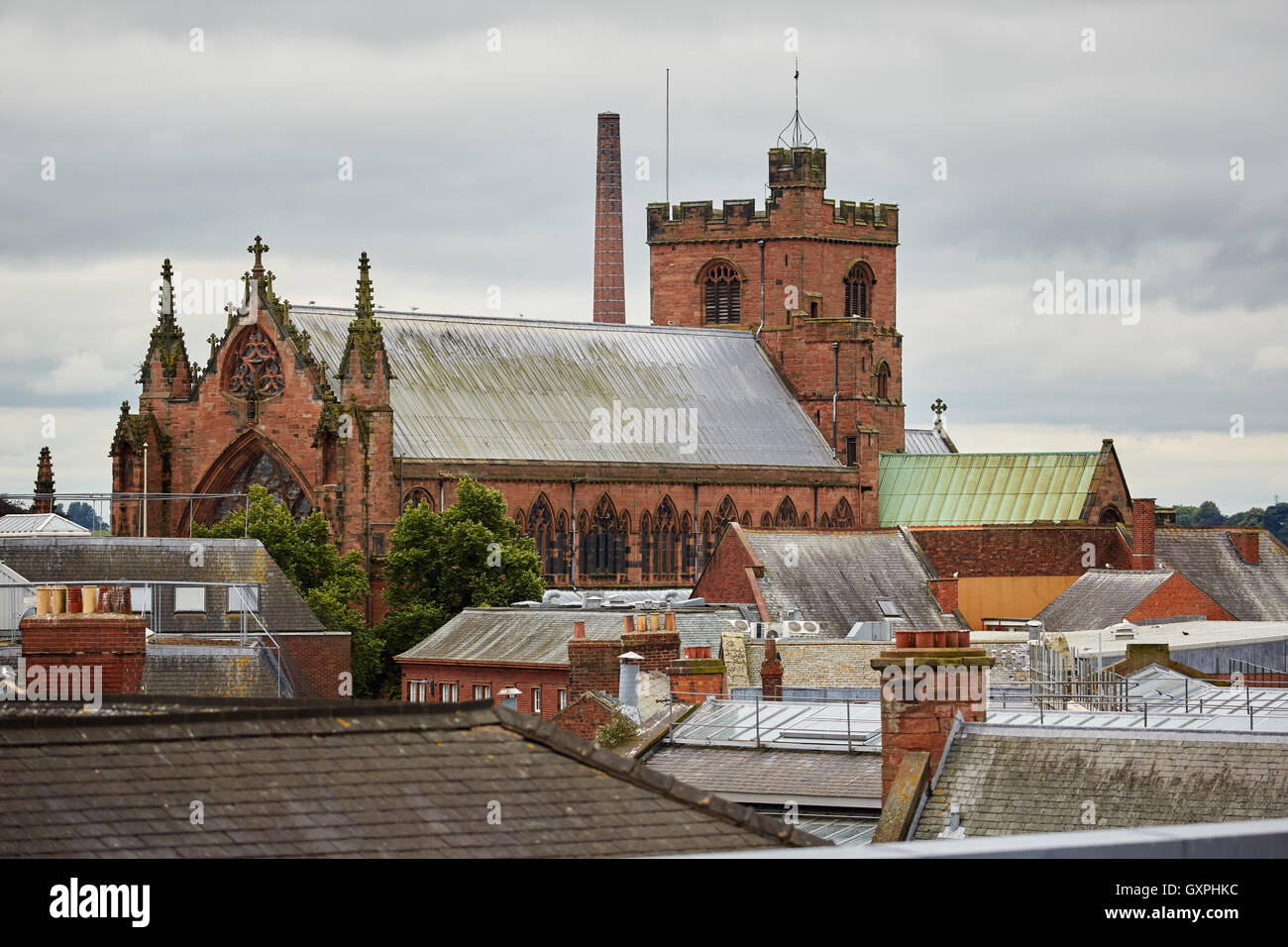 Carlisle historic market indoor hall   Cumbria early Cathedral Church of the Holy and Undivided Trinity over rooftops historic a Stock Photo