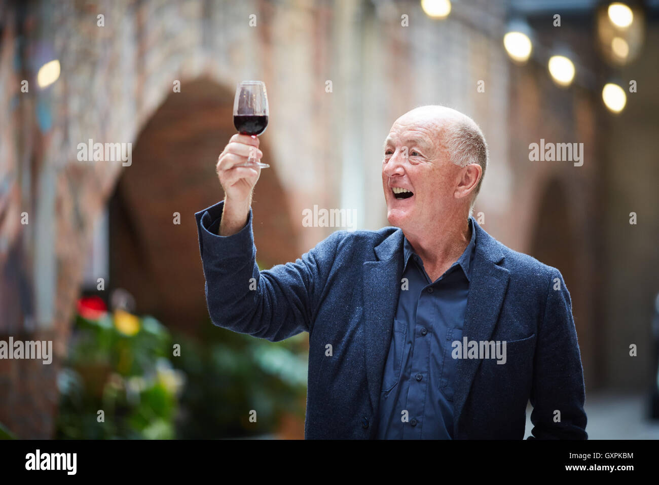 Bolton Food and Drink Festival  wine expert Oz Clarke television presenter and broadcaster red wine glass holding looking at cop Stock Photo