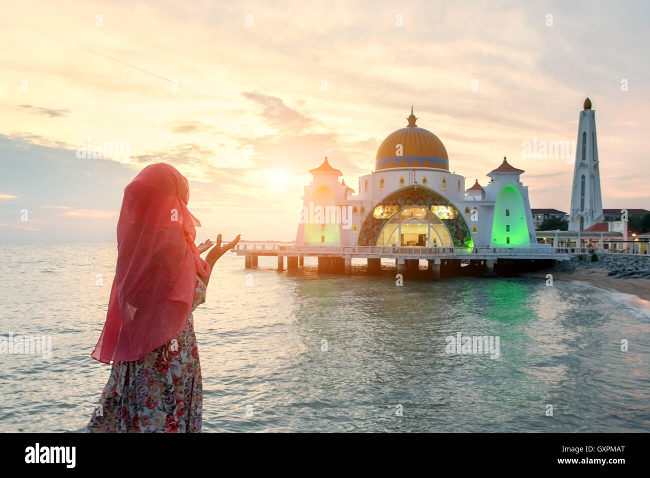 Malacca Straits Mosque with Muslim pray in Malaysia. Malaysian Muslim with mosque religion concept. Stock Photo