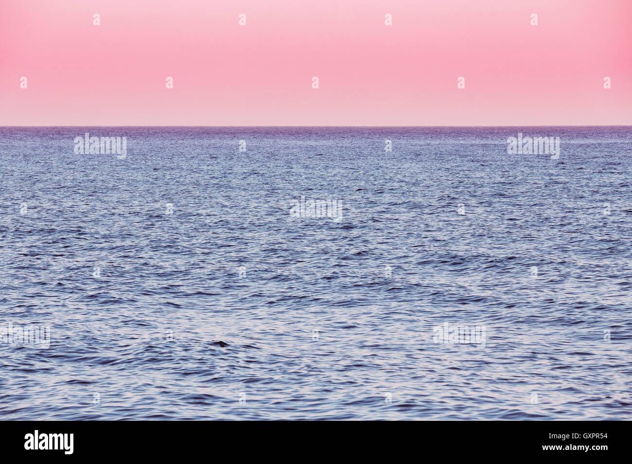 Calm Sea Ocean And Pink Red Sky Sunset Sunrise Background Stock Photo