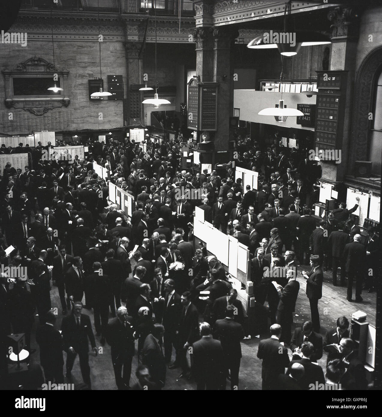 1950s, historical, general activity inside the large trading hall of the London stock exchange, London, England. Stock Photo
