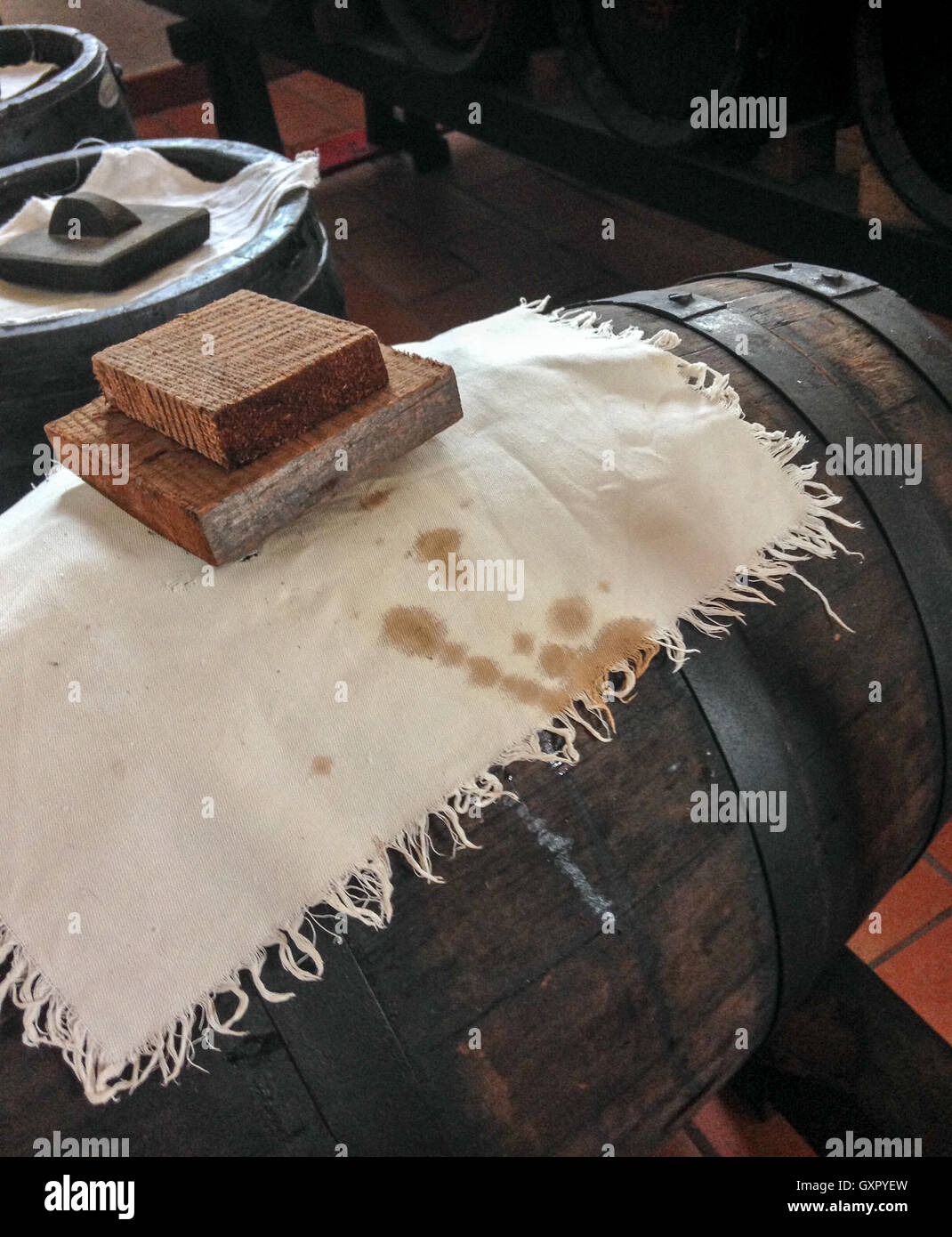Balsamic vinegar preparation. Barrel with white cloth. Stock Photo
