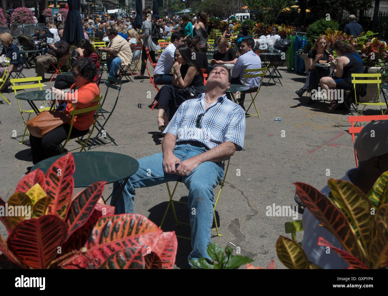 Man having some sun at Herald Square, Manhattan, New York, NY Stock Photo