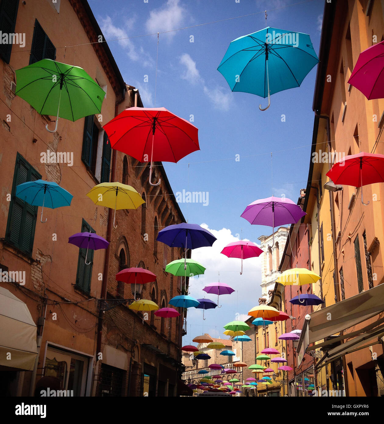 Colorful umbrellas floating in the air Stock Photo