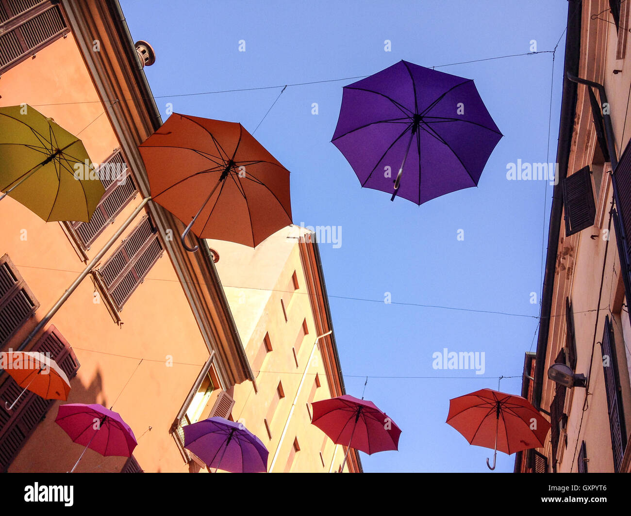 Colorful umbrellas floating in the air Stock Photo