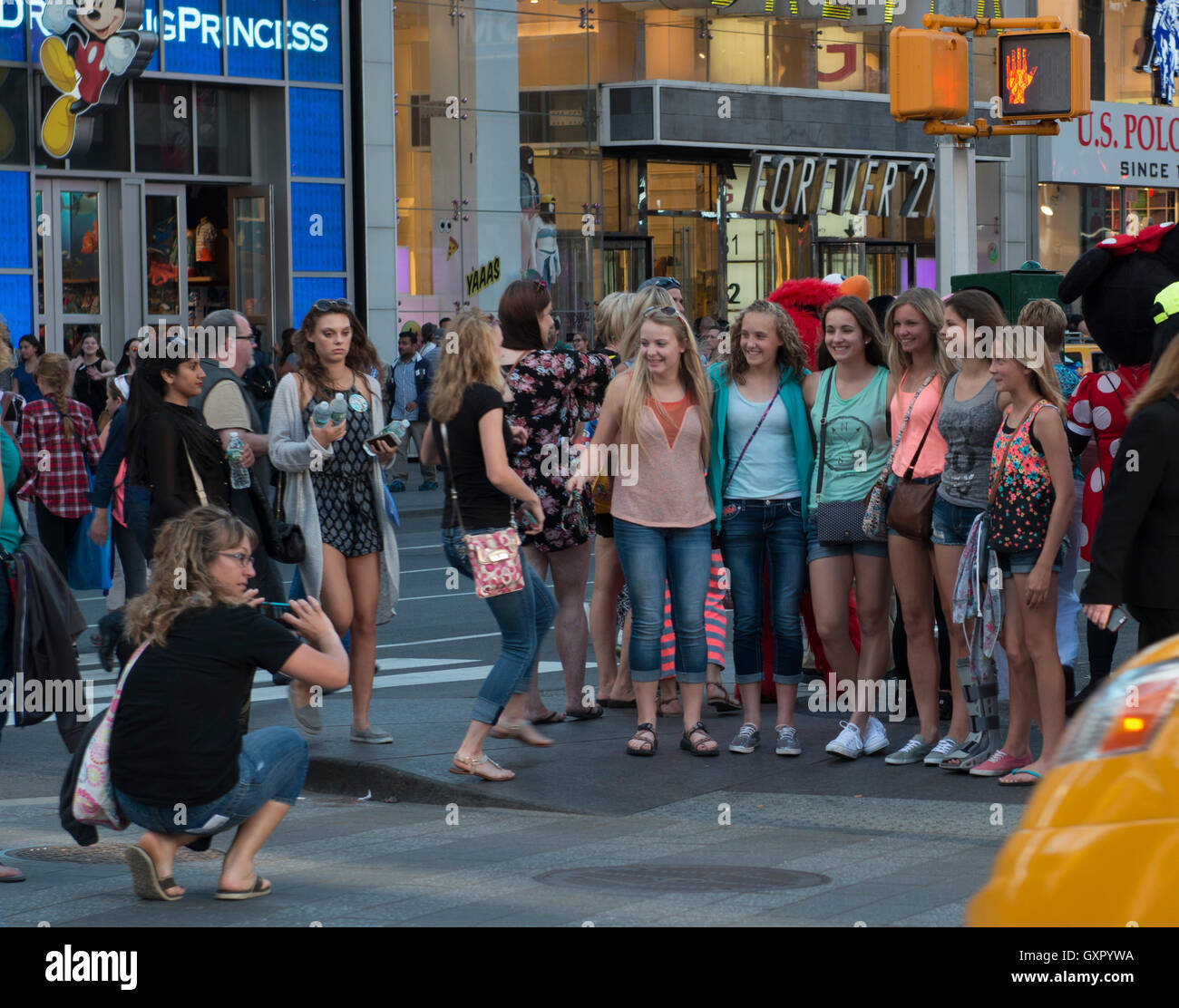 Group of women taking a photo at Time Square, Manhattan, NYC Stock