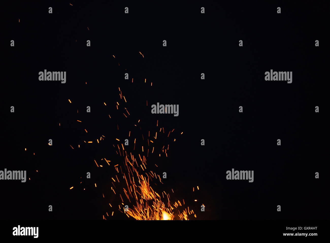 sparks from bonfire in the night with dark background Stock Photo - Alamy
