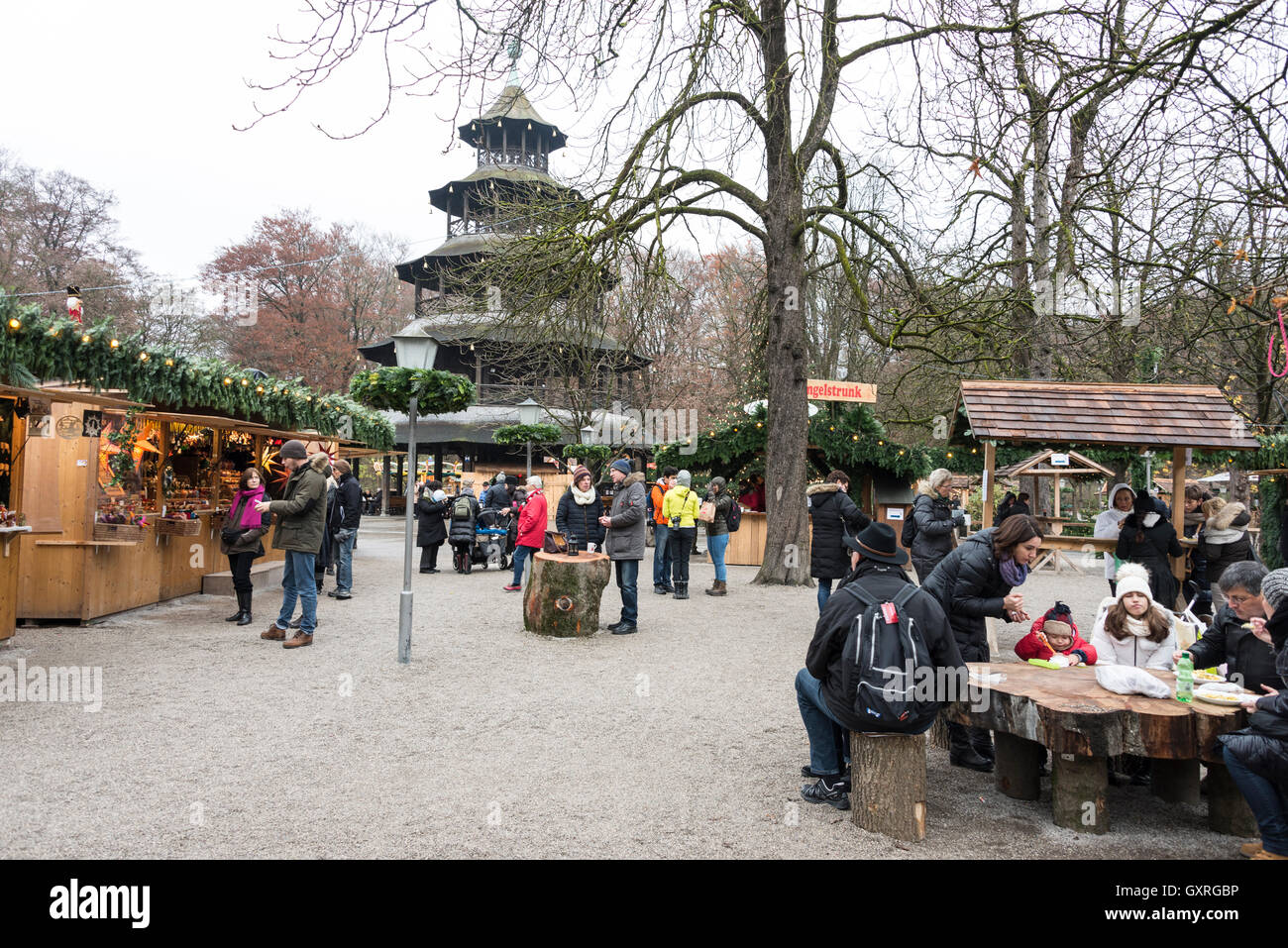 A Christmas market was held around the wooden structured Chinese Tower in the English Gardens in Munich, Bavaria, Germany. Stock Photo