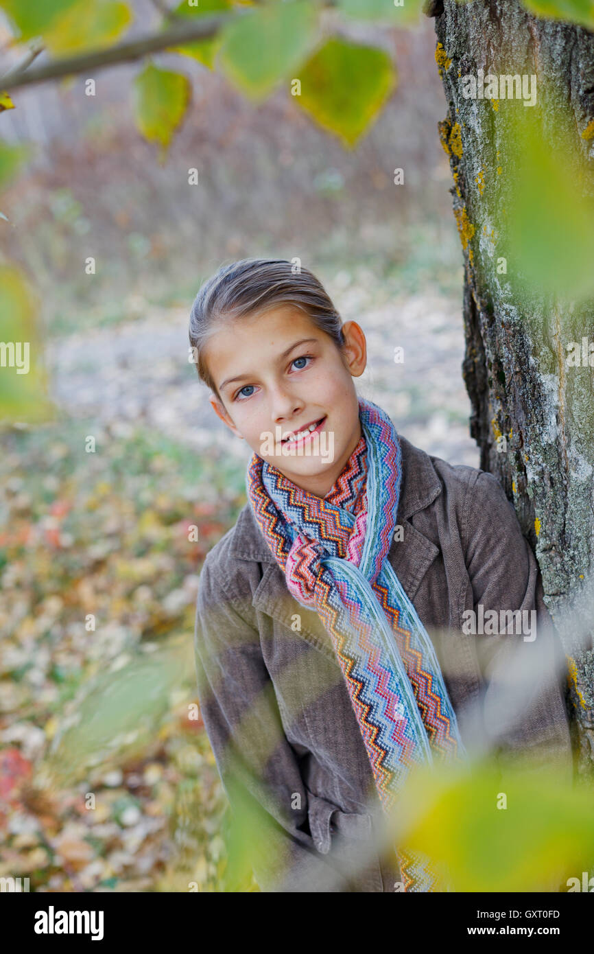 Girl walking in a autumn park Stock Photo - Alamy