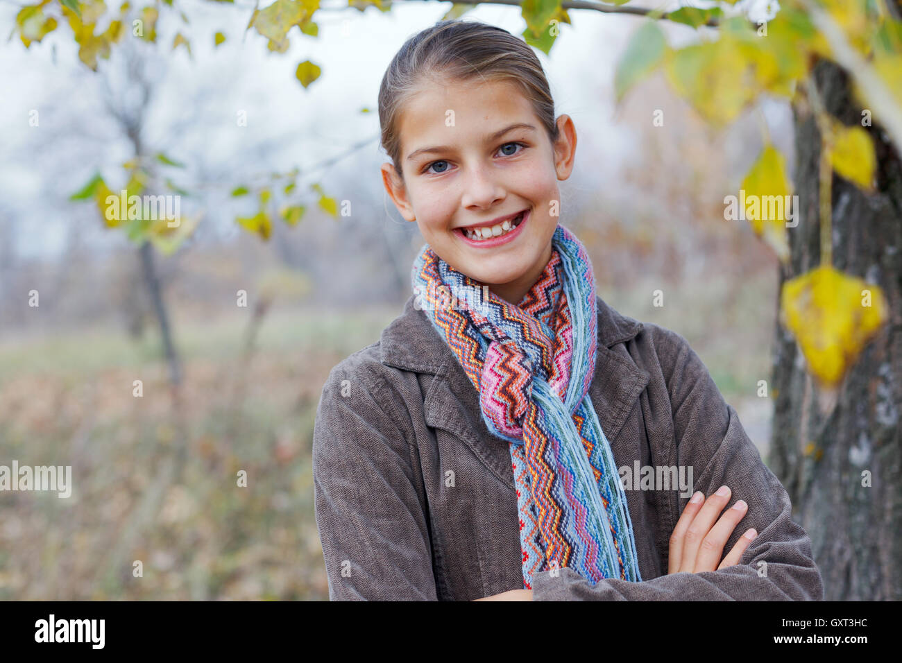 Girl walking in a autumn park Stock Photo - Alamy