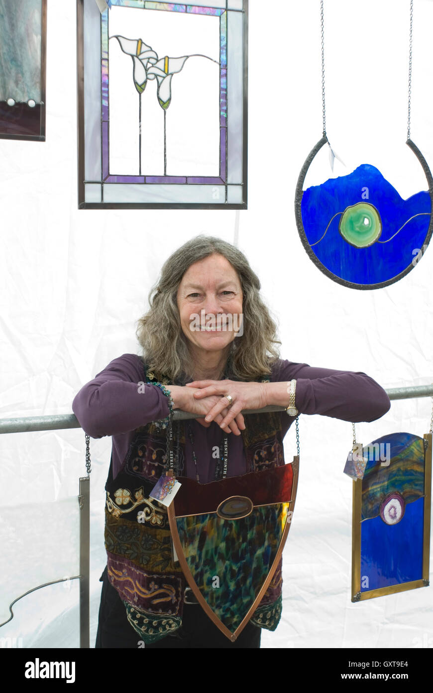 Claudia Ariss amidst some of her glass creations Stock Photo