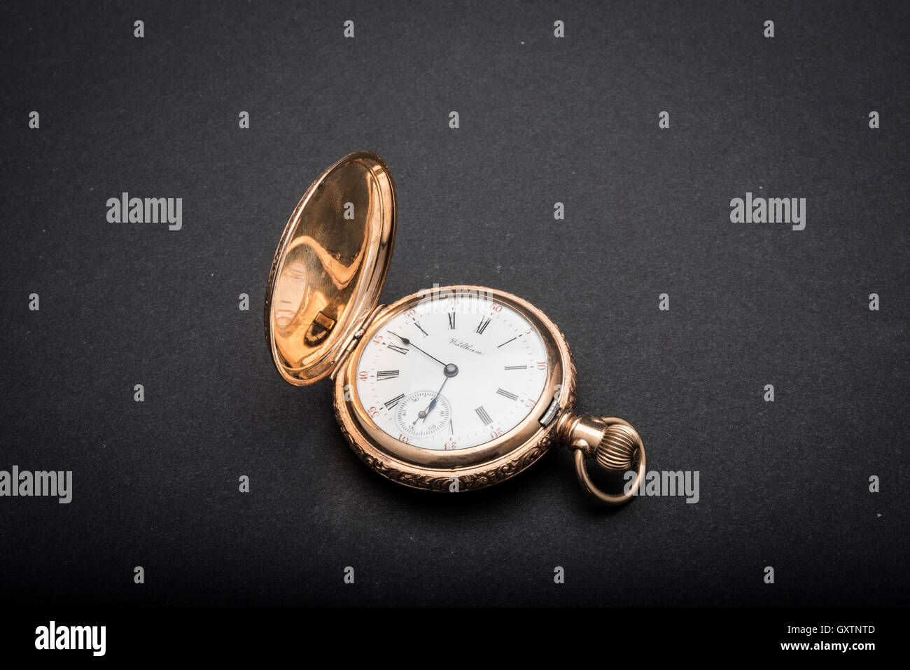 Gold vintage pocket watch on dark background Stock Photo - Alamy