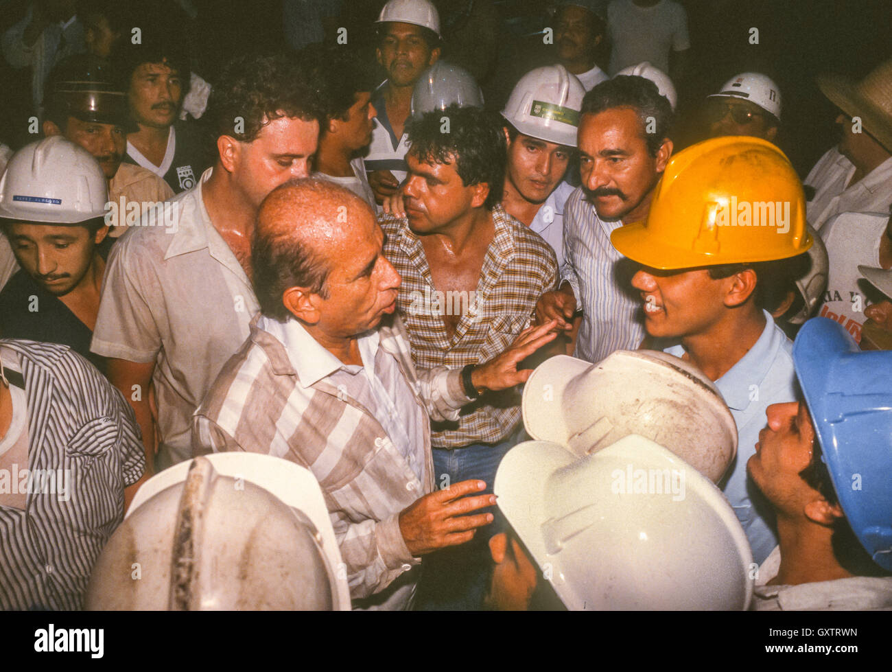 CIUDAD GUAYANA, VENEZUELA - Presidential candidate Carlos Andres Perez campaigning, meeting hard hat workers at SIDOR factory in October 1988. Stock Photo