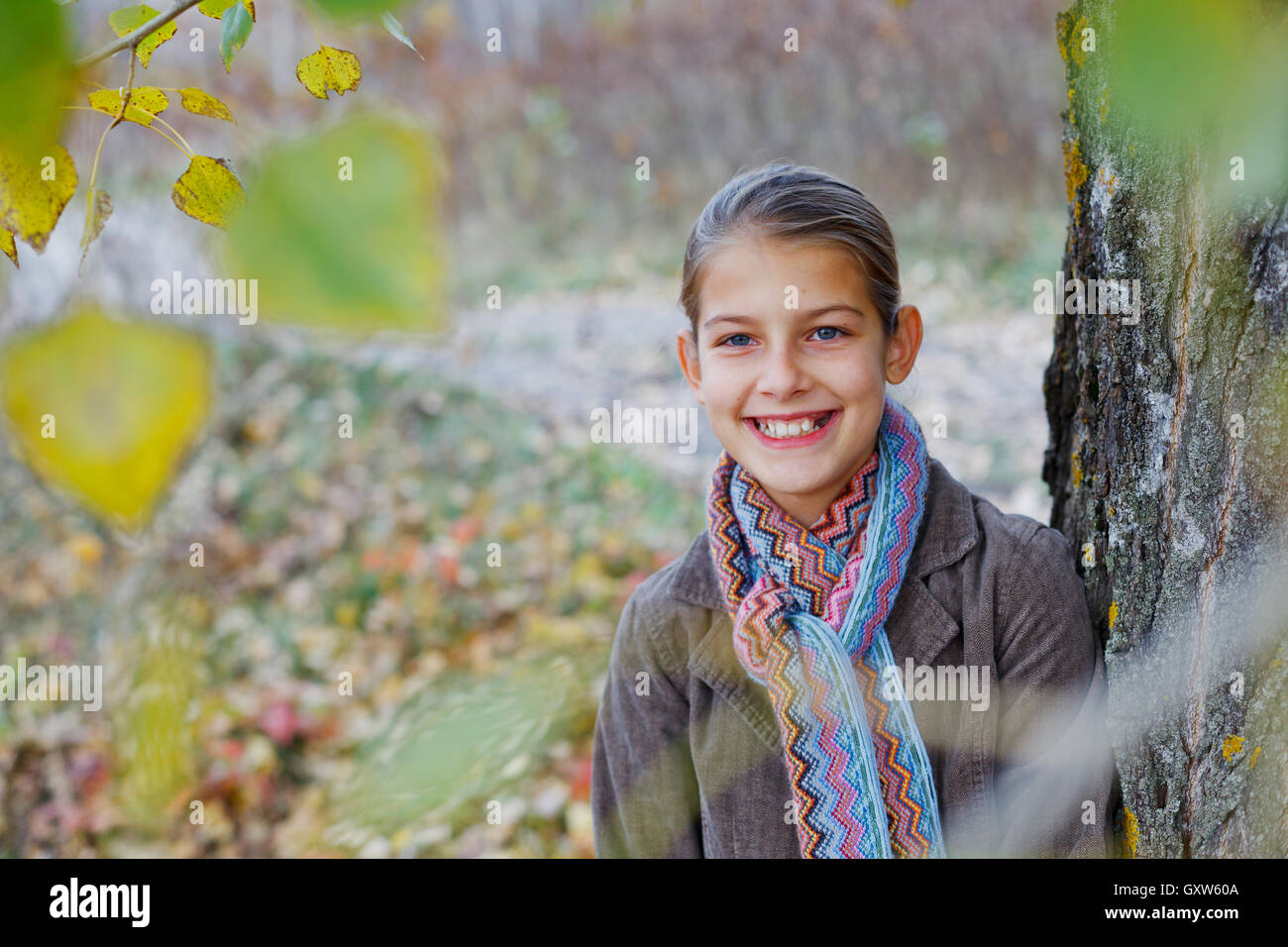 Girl walking in a autumn park Stock Photo - Alamy