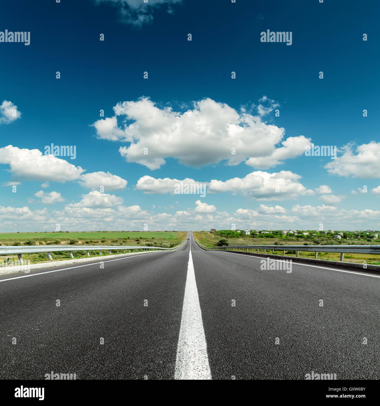 deep blue cloudy sky over asphalt road Stock Photo - Alamy