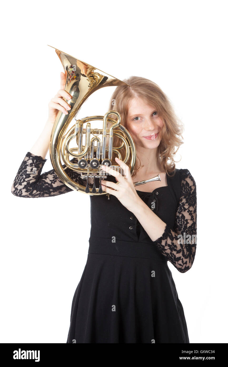 young pretty woman holding french horn Stock Photo - Alamy