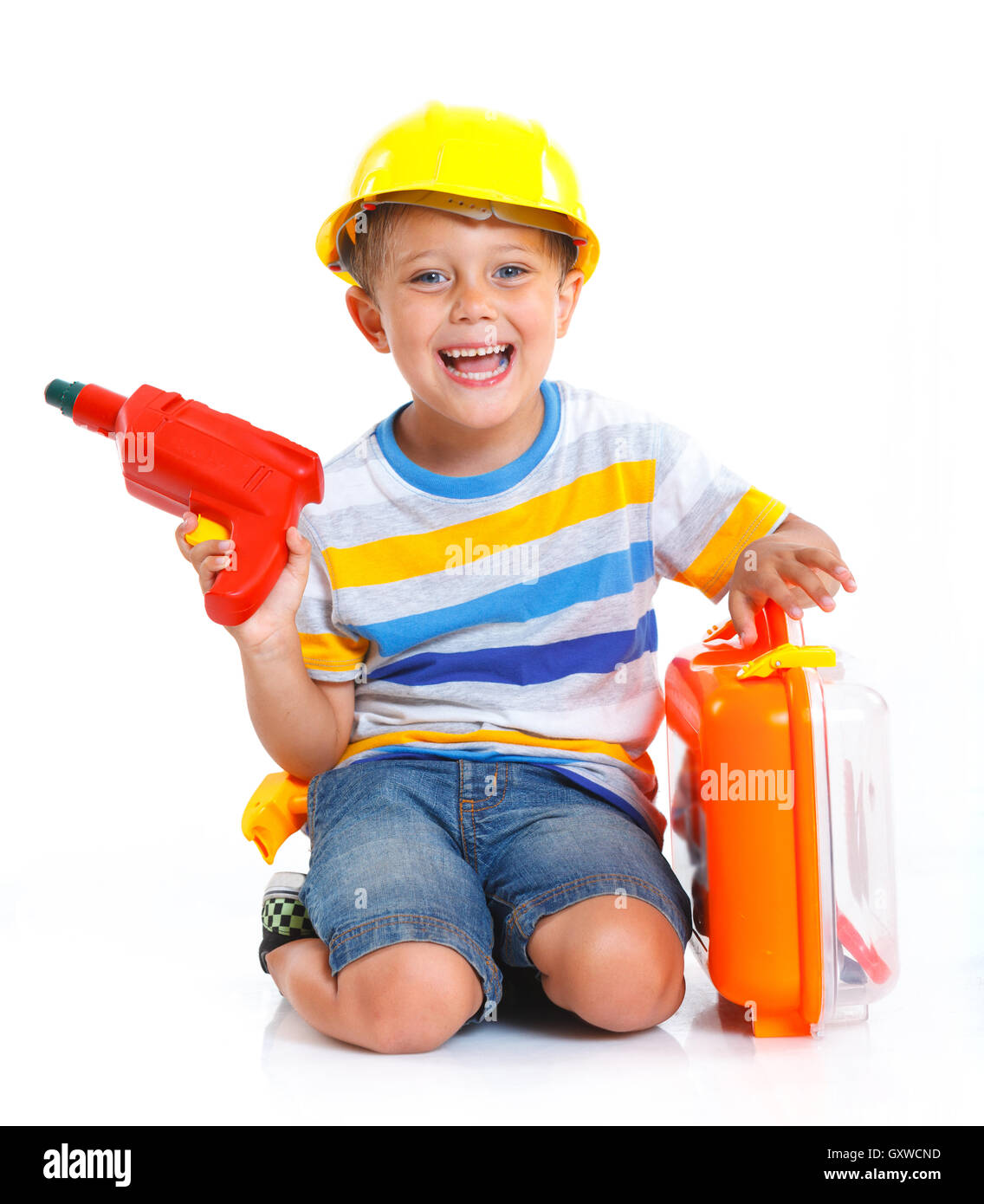 Boy in a helmet plays in the builder Stock Photo Alamy