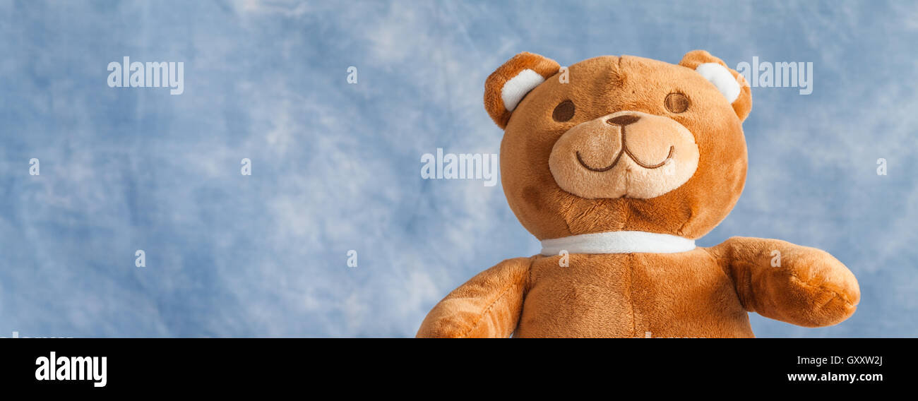 Teddy Bear toy on blue sky background with copyspace Stock Photo - Alamy