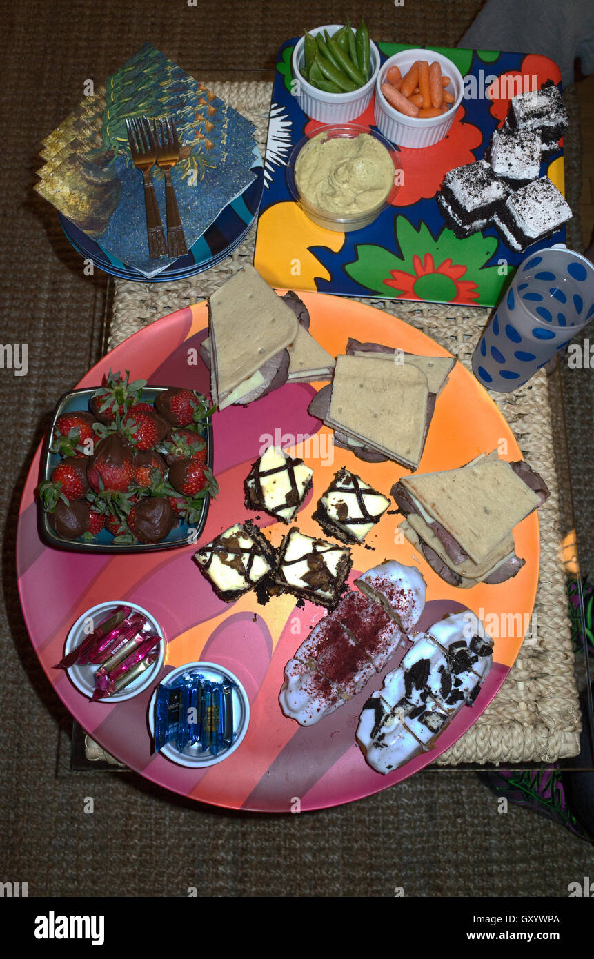 Array of appetizers including fresh strawberries, vegetables, pastries  and sandwiches. St Paul Minnesota MN USA Stock Photo