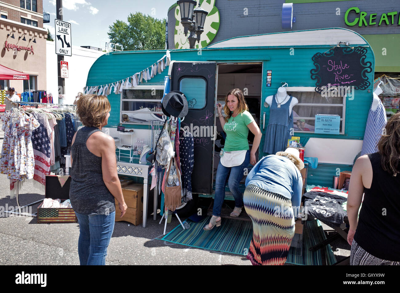 Proprietor of the Style Hive Traveling Boutique greeting Grand Old Day  customers from her mobile home. St Paul Minnesota MN USA Stock Photo - Alamy