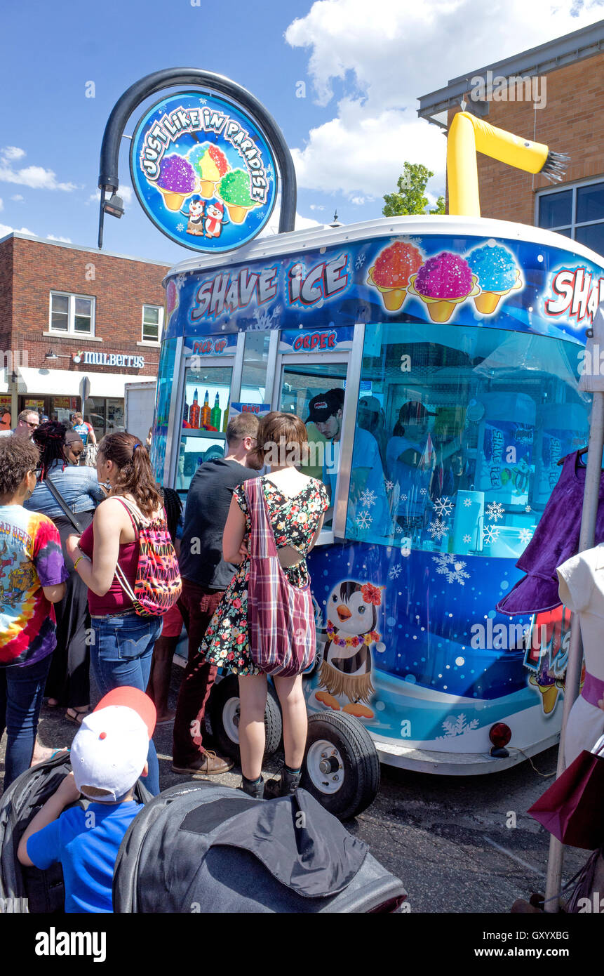 Glitzy mobile trailer selling shave ice cones at Grand Old Day