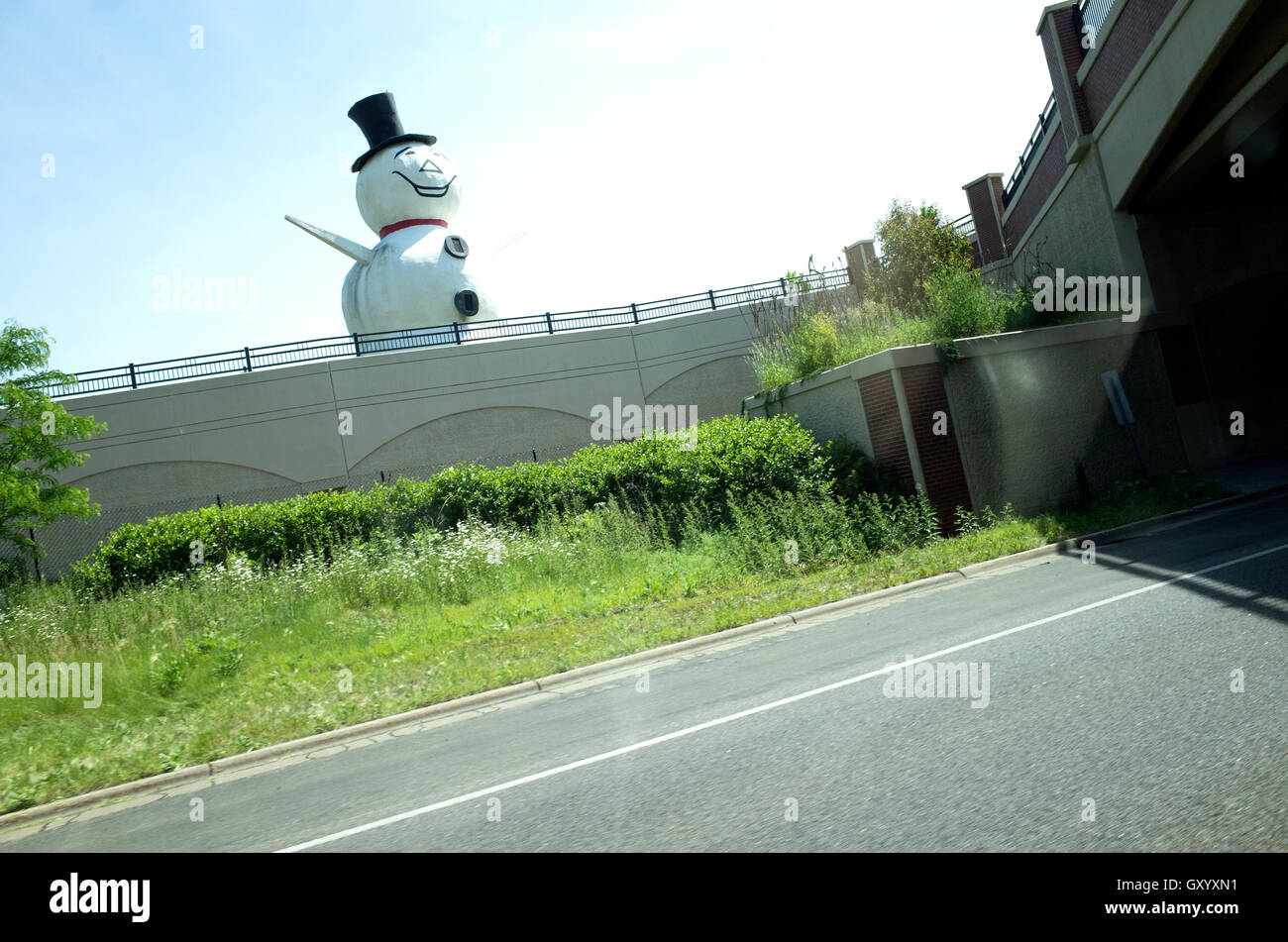 Snowman with top hat is the cities official mascot dwelling along Highway 36 in all seasons.  White Bear Lake Minnesota MN USA Stock Photo