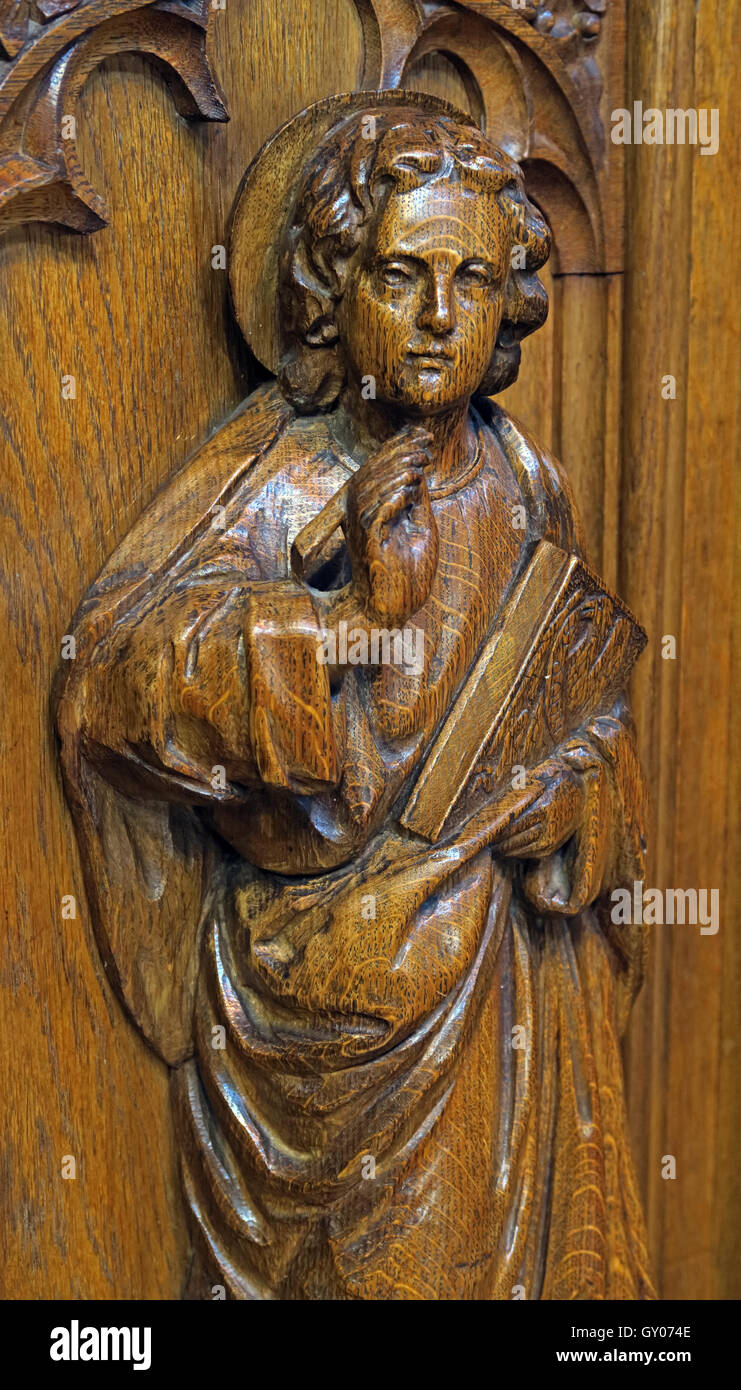 St Wilfrids Church Grappenhall- Pulpit wood carving of angel with bible, Warrington Stock Photo